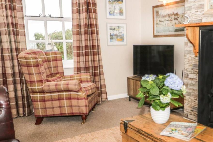 2 OLD COASTGUARD HOUSE, pet friendly, with open fire in Beaumaris