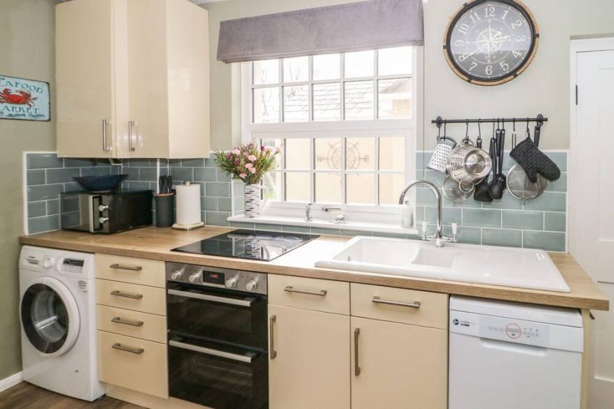 2 OLD COASTGUARD HOUSE, pet friendly, with open fire in Beaumaris