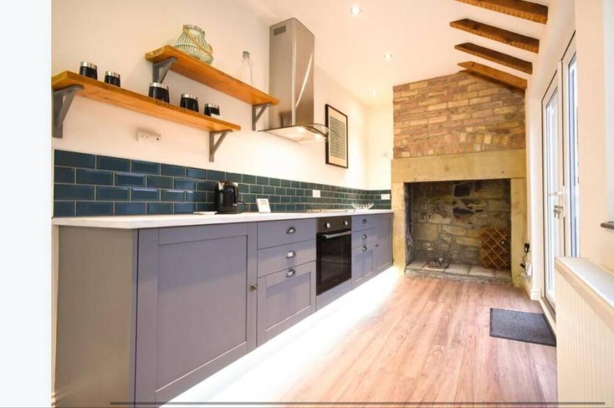 Dougie's Den, charming stone built mid-terrace town house .