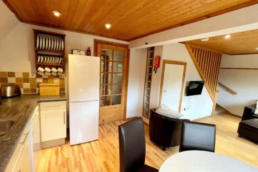 A lovely 3-bedroom holiday lodge (with a hot tub) in Devon. Pet-friendly.