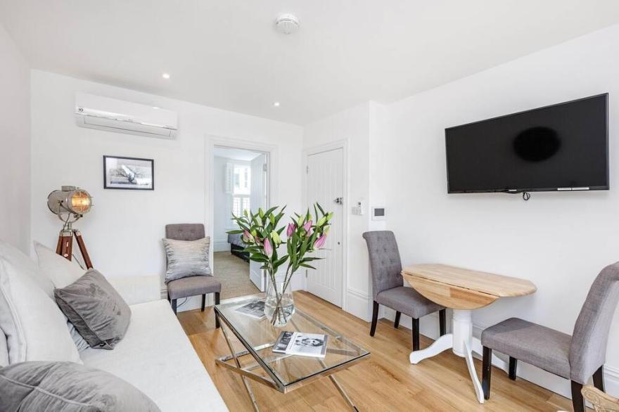 First Floor with SW balcony  by Fulham Broadway