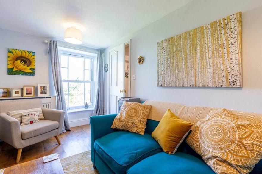 A cosy cottage full of character, comfort & style...