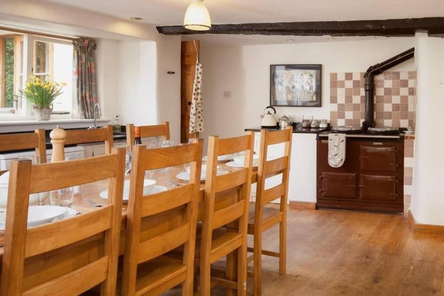 Thatched Devon longhouse, close to sea, with private indoor swimming pool.