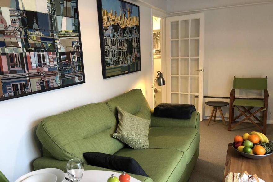 Contemporary apartment with parking, lift and balcony, close to seafront & town.