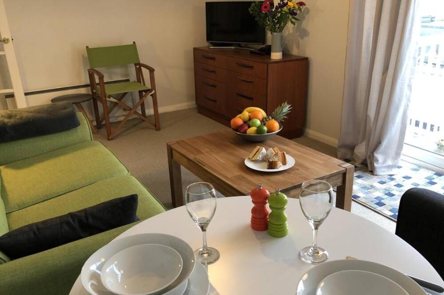 Contemporary apartment with parking, lift and balcony, close to seafront & town.