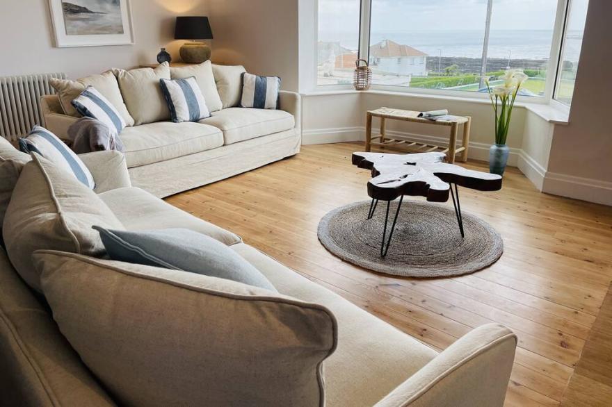 The View has stunning Sea Views, 100m to the beach, Hot Tub, Parking+EV Charger