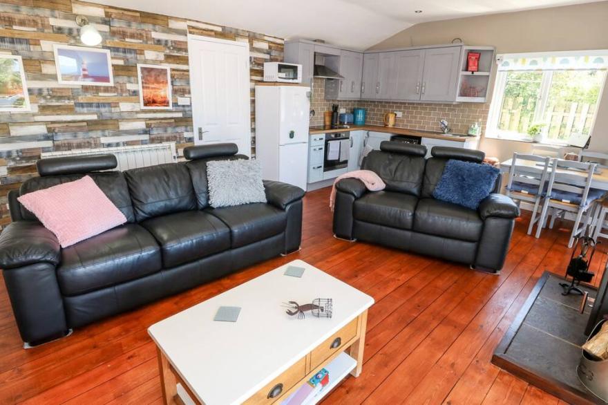 HARBOUR LIGHTS, pet friendly, country holiday cottage in Church Bay