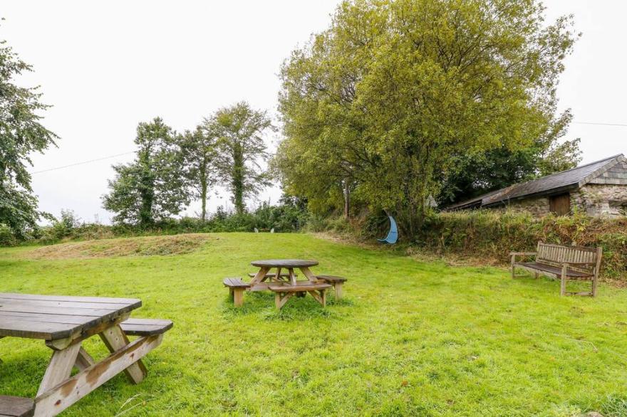 TREVERBYN SMITHY, pet friendly, character holiday cottage in St Neot