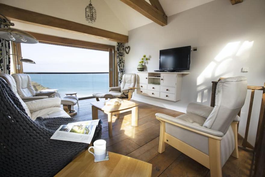 Stunning front line Beach House with incredible sea views, parking & garden