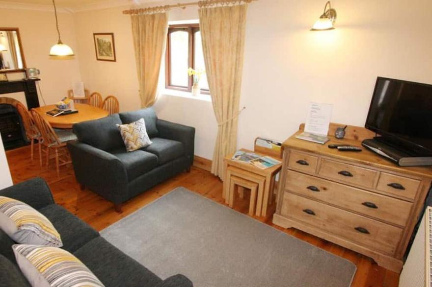 Treveglos Barn, a semi-detached barn conversion set to one side of the road from Newquay to Padstow