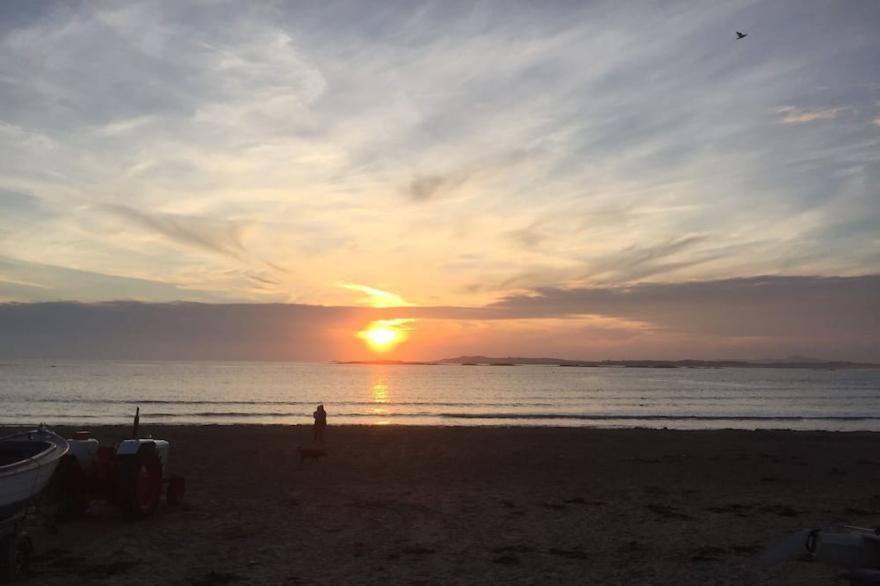 Detached family holiday home with enclosed garden just moments from the beach.