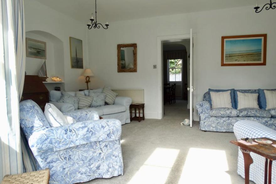 Detached family holiday home with enclosed garden just moments from the beach.