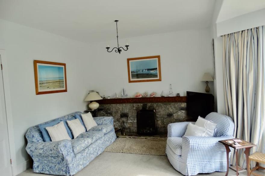 Detached family holiday home with enclosed garden just moments from the beach.