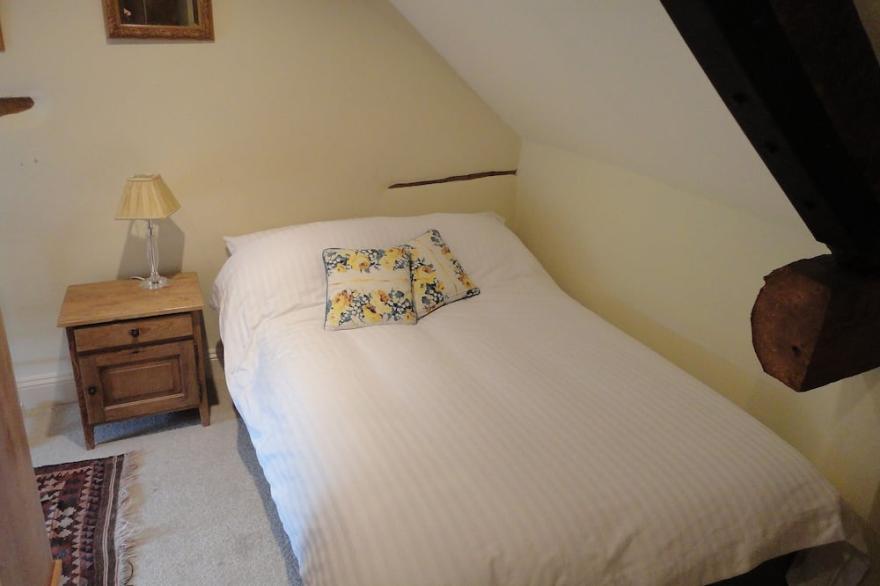 Small converted barn in peaceful village setting.