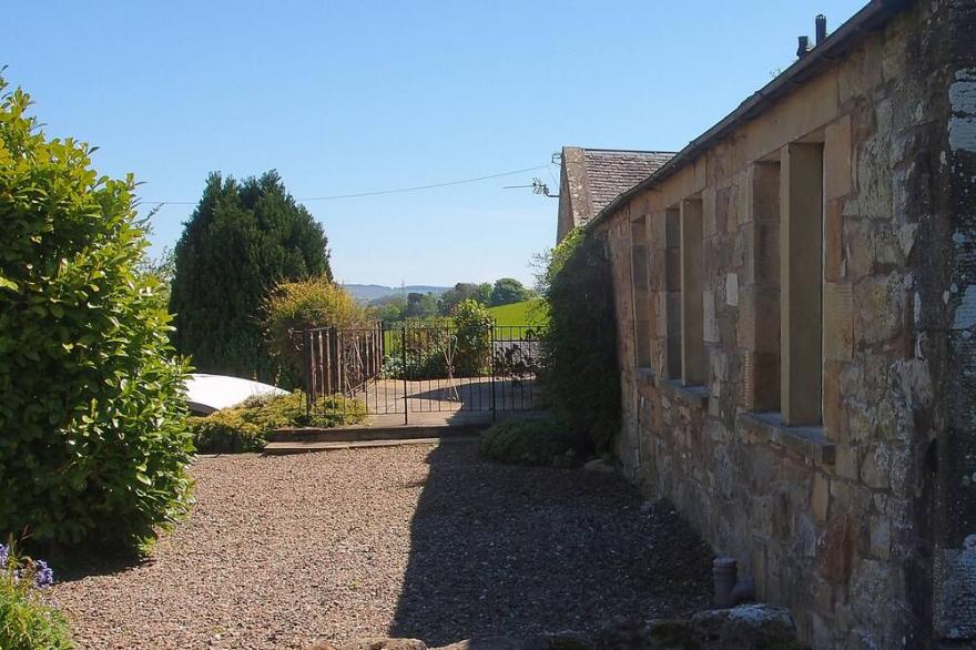 The Steading cottage with large gardens, south-facing patio with great views!