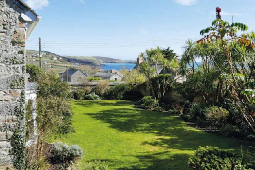 Beautiful 4 bedroom house that is part of a larger home.  Beach views and garden