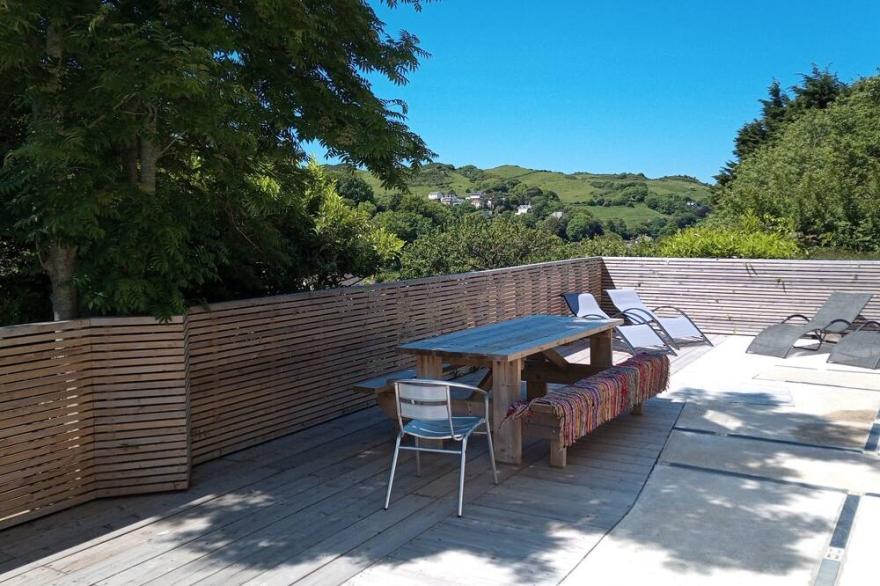 Detached house with countryside views, large private garden and sun terraces.