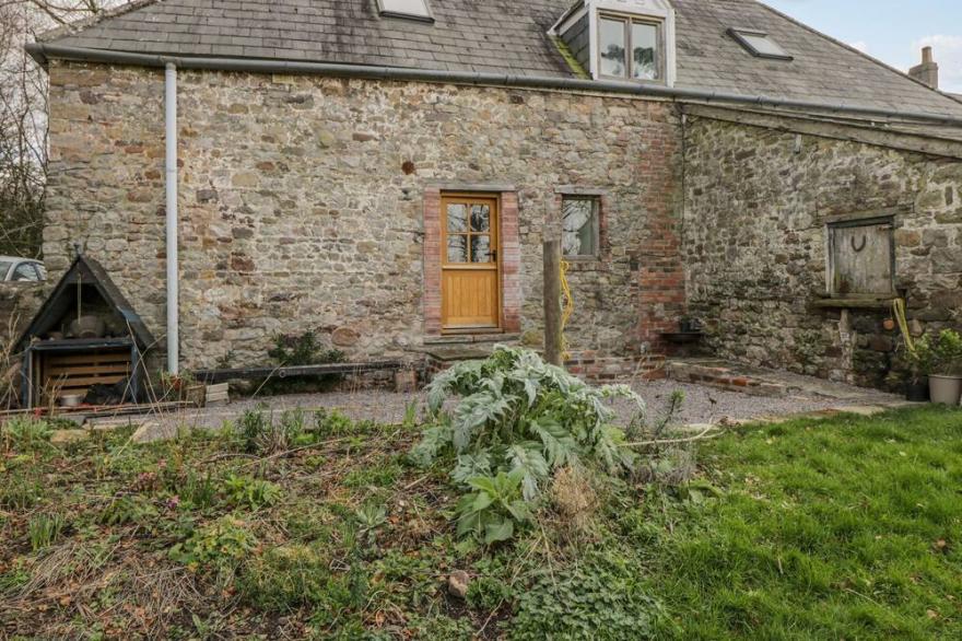 THE OLD STABLES, with a garden in Usk