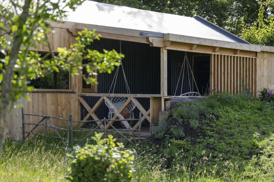 Unique wildlife lodge in West Sussex, sleeps 4 with log burner and private hot tub