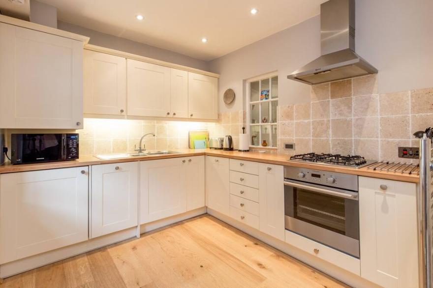 A contemporary three-bedroom open plan apartment with private parking space. Sleeps 6.