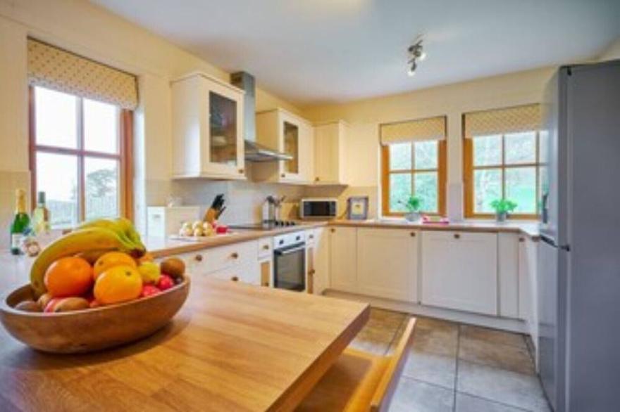 Country farmhouse sleeps 9 with enclosed garden and games barn.