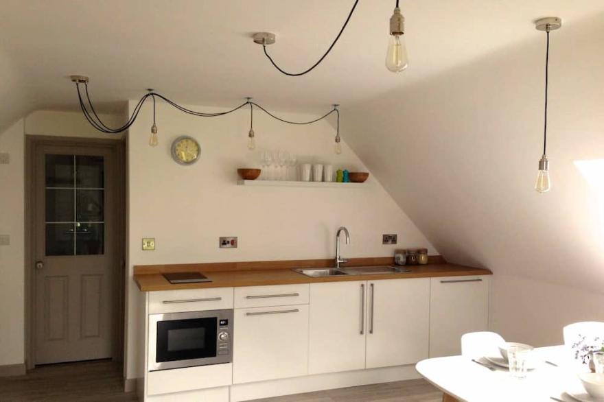 Stylish loft apartment on large working farm near Glastonbury and Wells