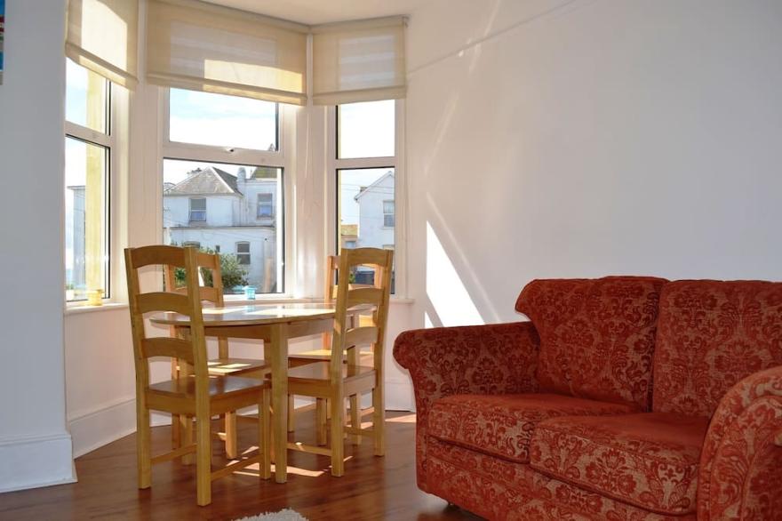 2-bedroom apartment steps from the beach, with garage and dog friendly!