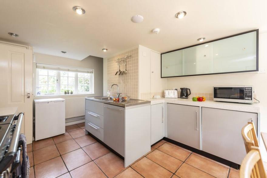 River cottage sits in a pretty rural setting with its own enclosed garden