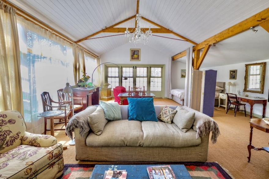 The Garden Room. Timber framed, light and airy accommodation with veranda.