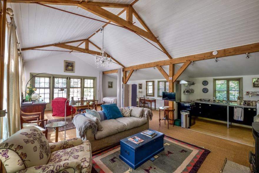 The Garden Room. Timber framed, light and airy accommodation with veranda.