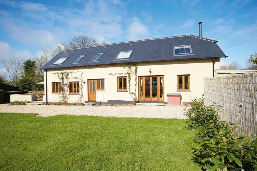 Long Meadow Barn is a charming, spacious detached converted barn set in the village of Down St. Mary