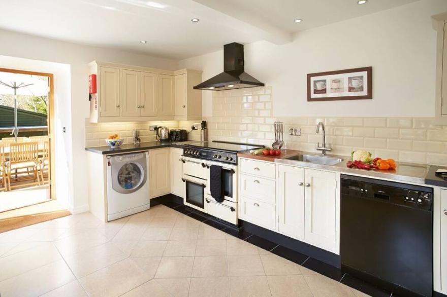 Long Meadow Barn is a charming, spacious detached converted barn set in the village of Down St. Mary