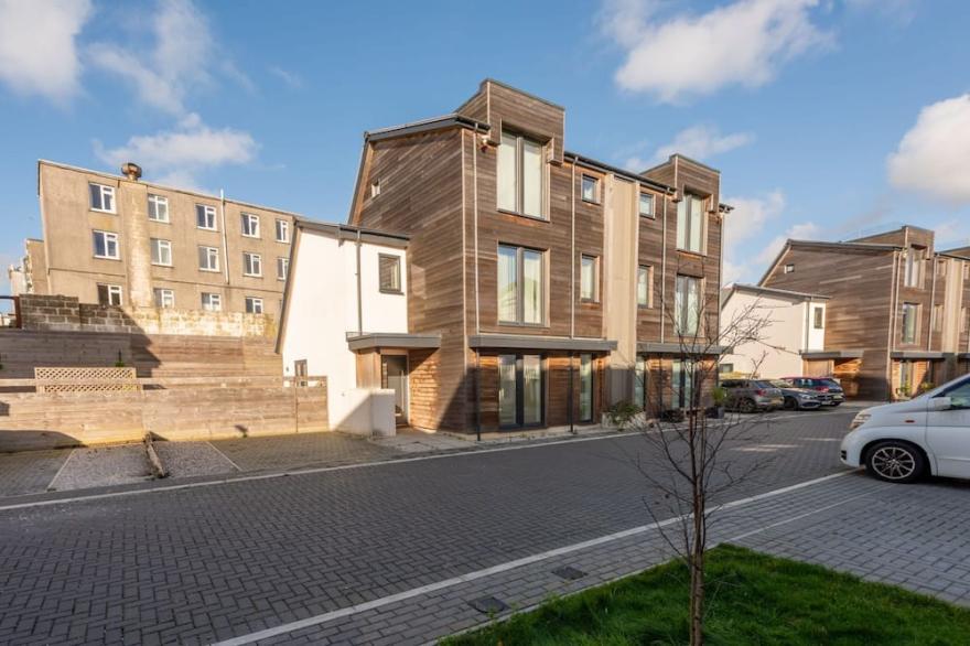 A stylish eco mews house with four bedrooms, enclosed garden and parking in Newquay
