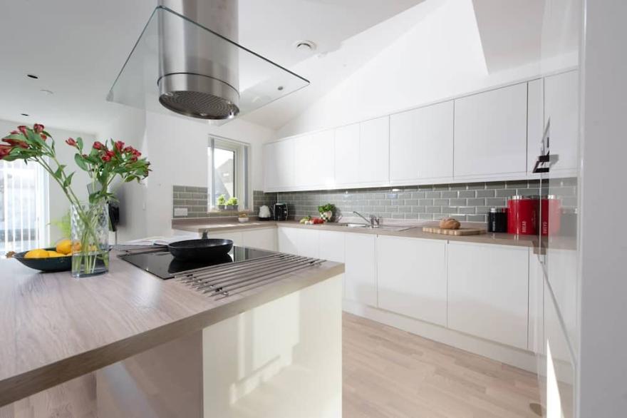 A stylish eco mews house with four bedrooms, enclosed garden and parking in Newquay