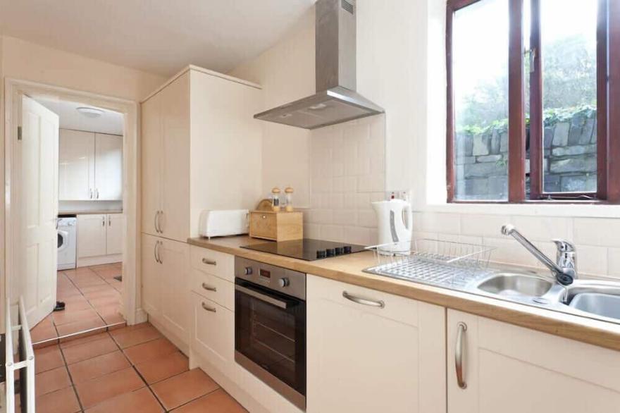 HONEYSUCKLE COTTAGE, with open fire in Bowness-On-Windermere