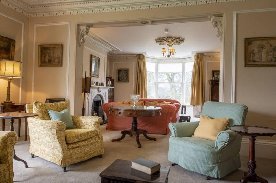 A handsome blend of Georgian and Victorian architecture, Upper Helmsley Hall will transport its gues
