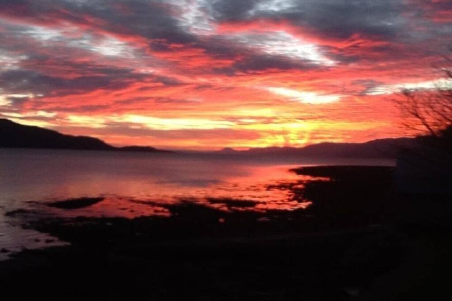 Lochside with beach access uninterrupted views of spectacular Highland Mountains