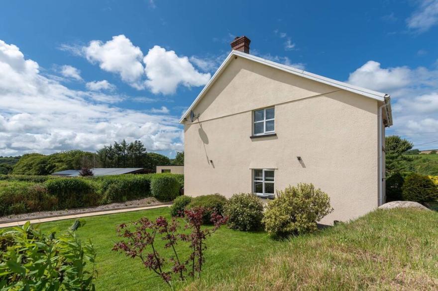 Spacious 4-bedroom farmhouse in North Devon countryside with hot tub