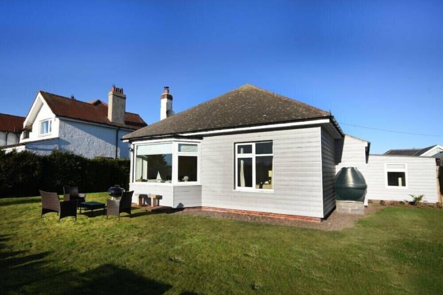 THE DUNES (BAMBURGH), pet friendly, with open fire in Bamburgh