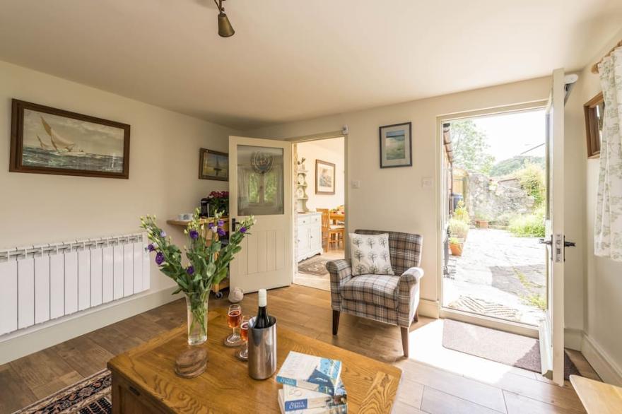 A charming detached stone cottage situated on an elevated site above Upwey.