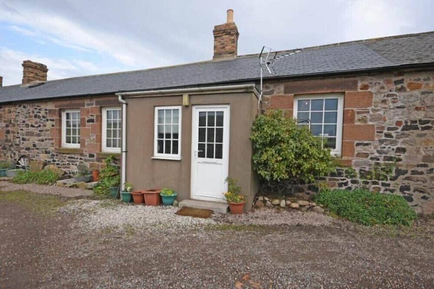 NO2 BUDLE BAY COTTAGE, pet friendly, with open fire in Bamburgh