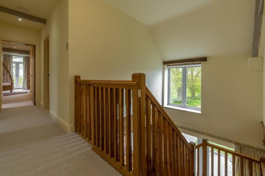 A fabulous, stand out conversion of a 19th century barn enjoying wonderful open rural views that ext