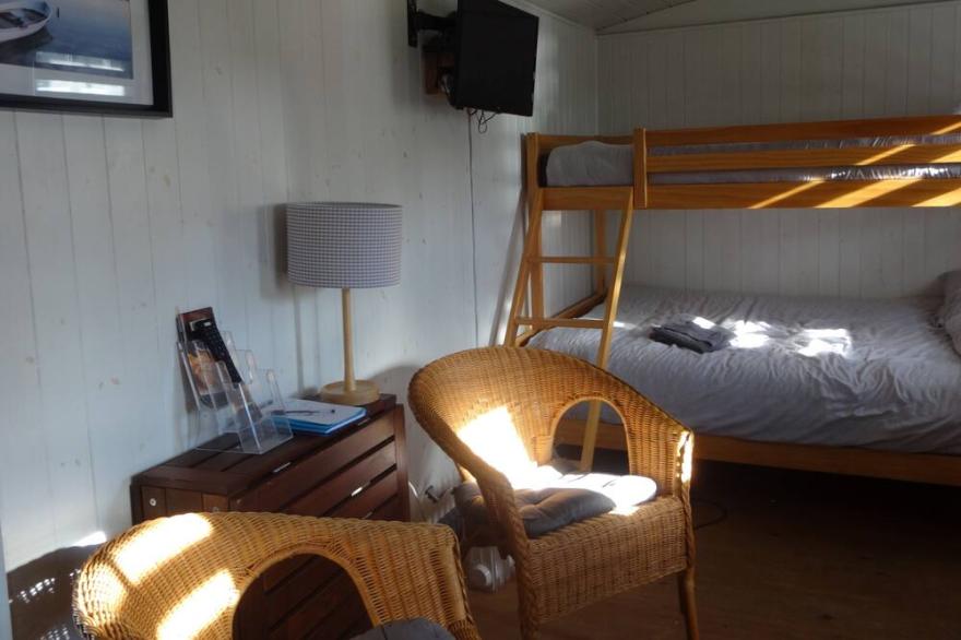 Shepherds hut with hot tub and onsite bistro and gym close to Hadrian's Wall and beach.
