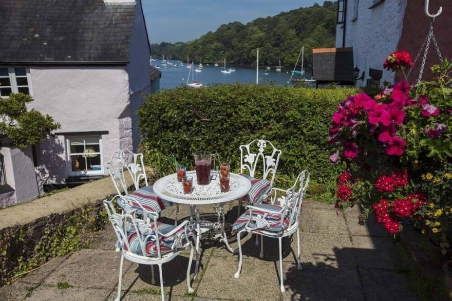 Characterful cottage a stones throw from river Dart with front & back patios
