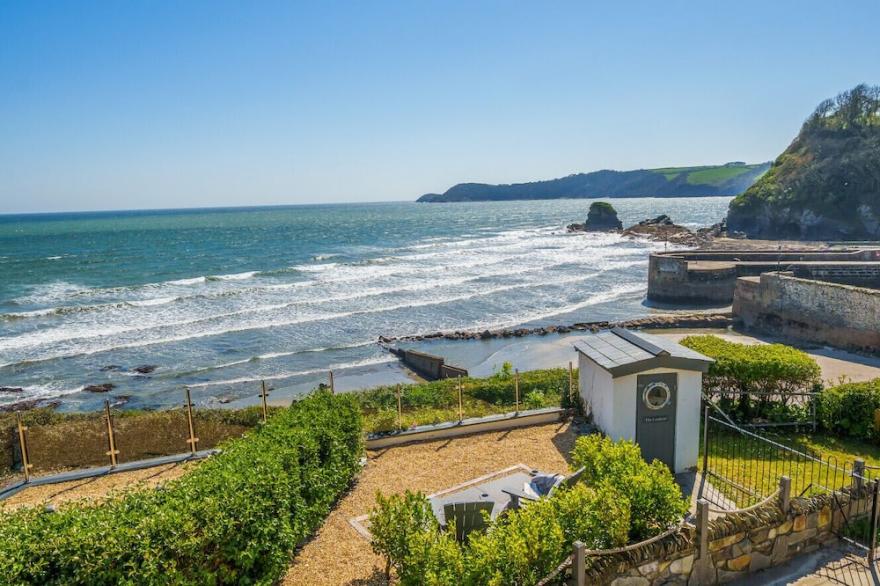 ON AMAZING SPACES! Luxurious Beach Front Retreat with Hot Tub & Log Burner