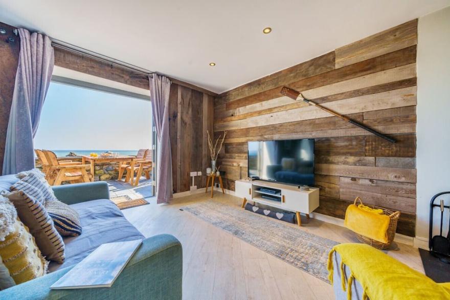 ON AMAZING SPACES! Luxurious Beach Front Retreat with Hot Tub & Log Burner