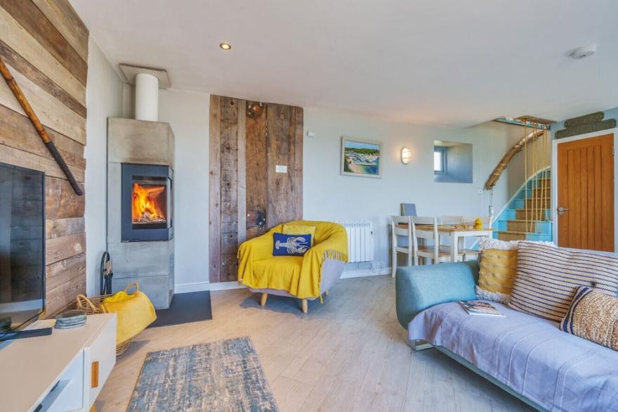 ON AMAZING SPACES! Luxurious Beach Front Retreat with Hot Tub & Log Burner