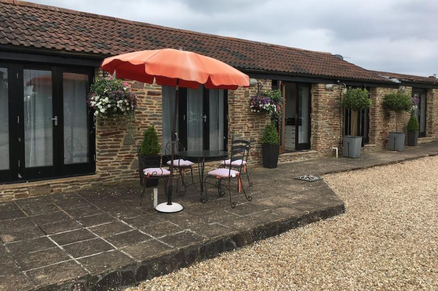 Elegantly furnished former barn in quiet rural spot, South Cotswolds.