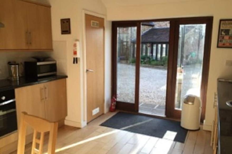 Elegantly furnished former barn in quiet rural spot, South Cotswolds.