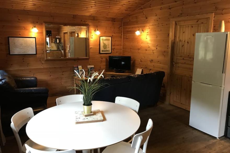 Finnish Holiday Lodges, set in wooded hillside, with mountain and stream views